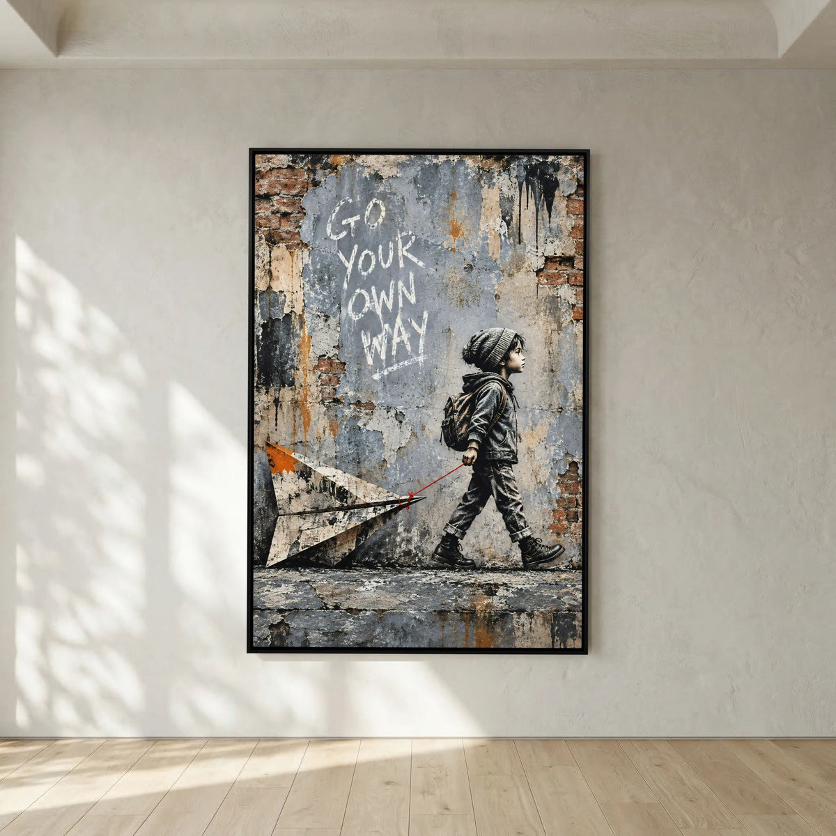 Gerahmtes Street Art Leinwandbild mit Kind, Rucksack und Papierflieger vor einer verwitterten Mauer
